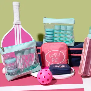 Miamica Pickleball collection items feature Cool Court Blue Bottle Set bags, a Pink "Wash Me" square laundry bag, and navy blue and glitter pink Pill Cases.